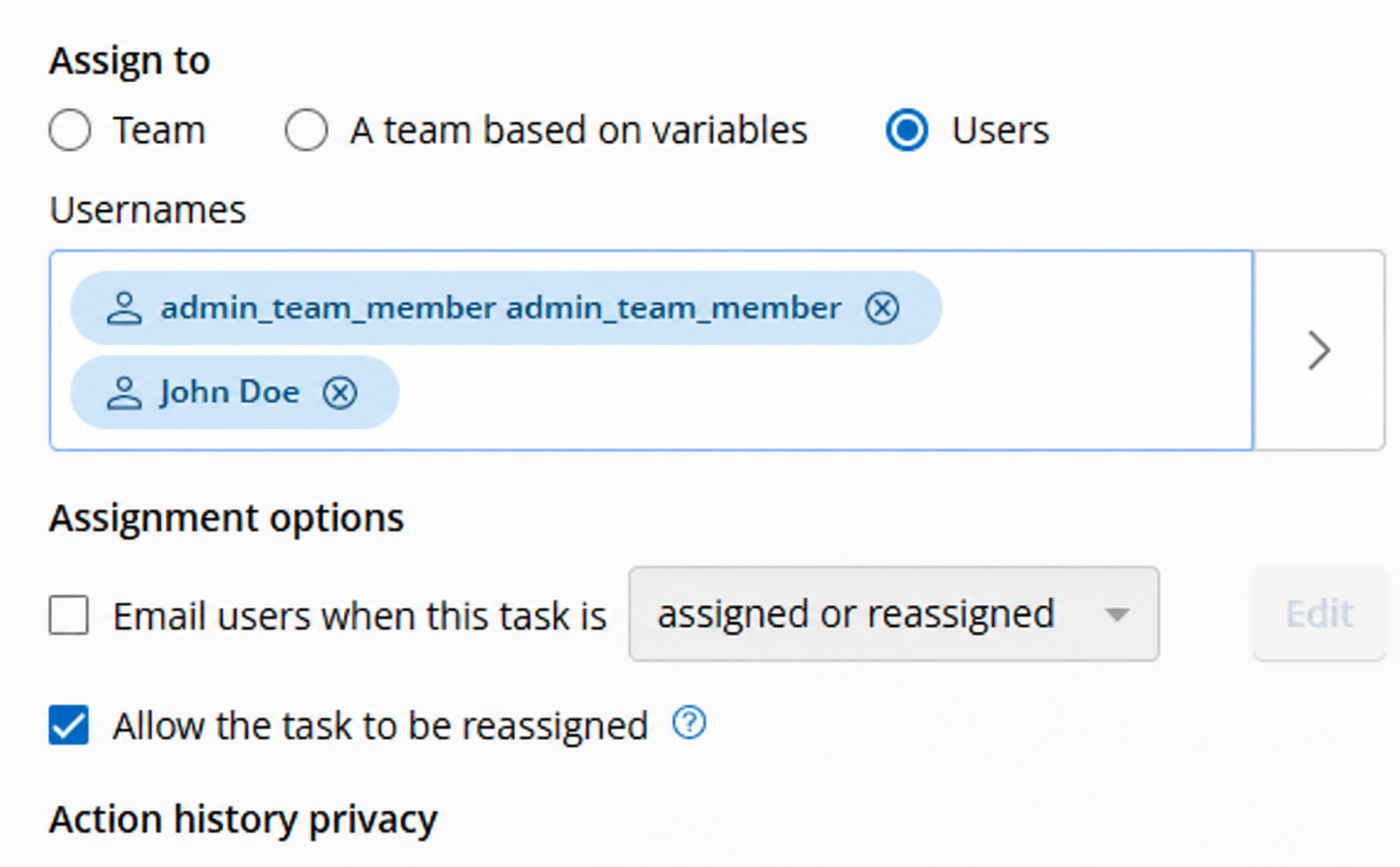 User Task properties showing Allow the task to be reassigned selected under Assignment Options